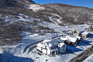 Snowy aerial view with a mountain view