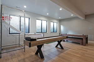 Rec room featuring light wood-type flooring and recessed lighting