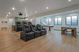 Cinema with light wood-type flooring, recessed lighting, and pool table