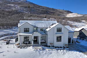 View of front facade featuring a mountain view and covered porch