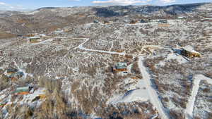 Snowy aerial view featuring a mountain view