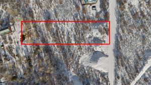 Snowy aerial view with property boundaries highlighted