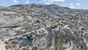Snowy aerial view featuring a mountain view
