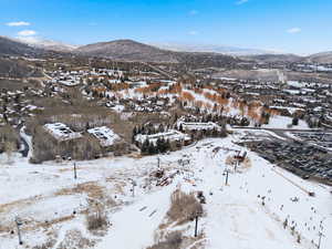 Snowy aerial view with a mountain view