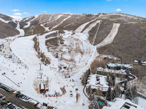 Snowy aerial view featuring a mountain view