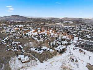 Snowy aerial view with a mountain view