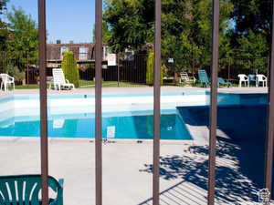 Community pool with a patio area