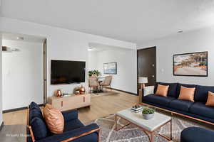 Living room with wood finished floors and baseboards