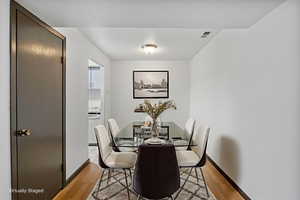 Dining space with light wood-type flooring