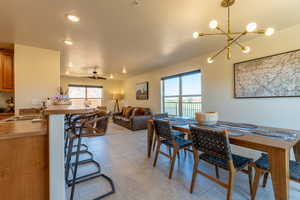 Dining Space and Kitchen Breakfast Bar with view of Living Area.