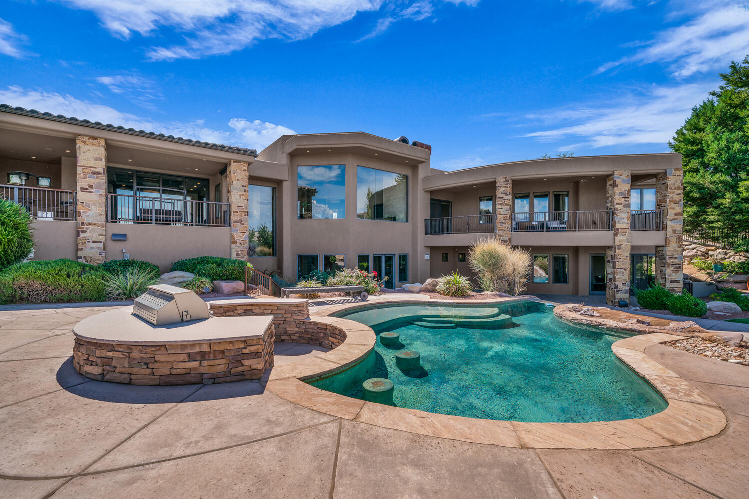 Swimming pool with a balcony and a patio