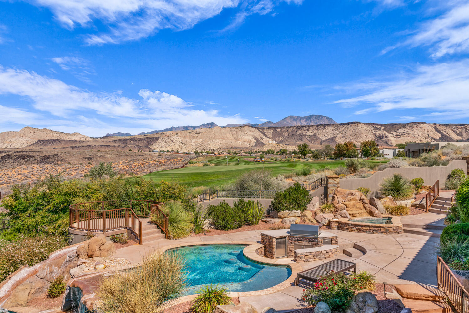 View of swimming pool featuring a patio area, a mountain view, a hot tub, and a fenced backyard