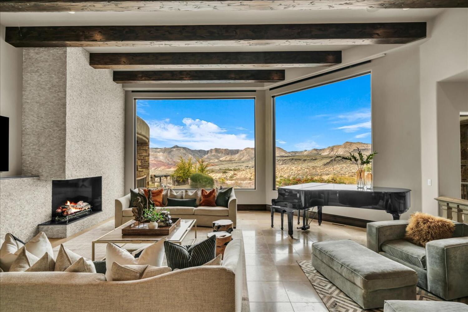 Interior space featuring a mountain view and an outdoor living space with a fireplace