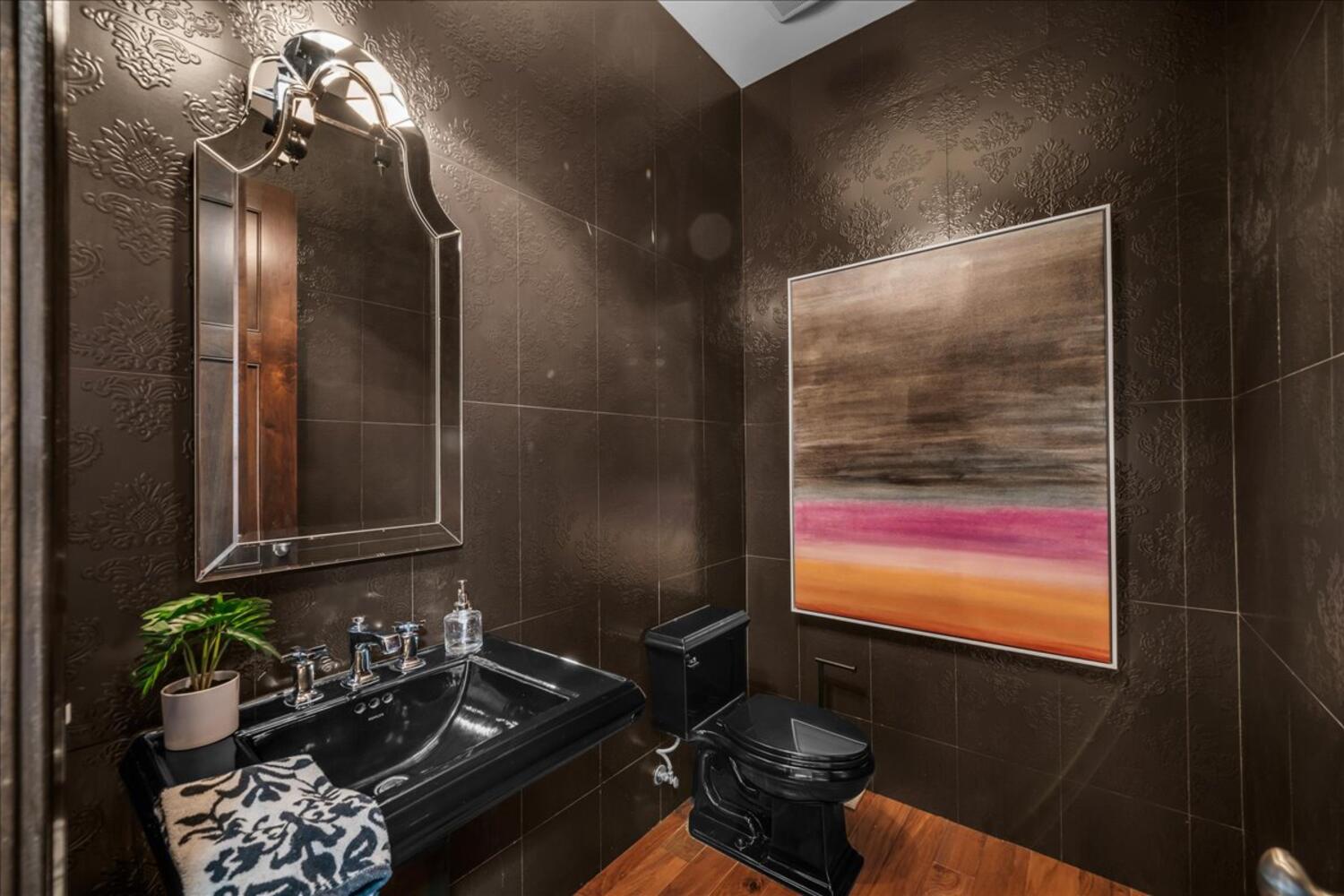 Half bathroom featuring toilet and a sink