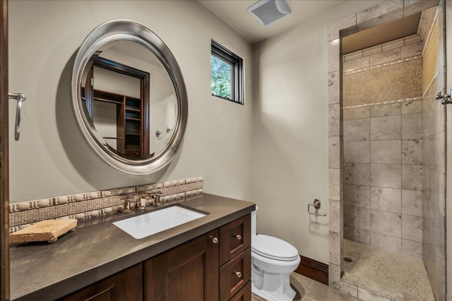 Full bath featuring vanity and a walk in shower
