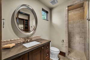 Full bath featuring vanity and a walk in shower