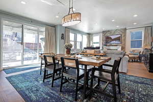 Dining room featuring dark wood-style flooring and recessed lighting