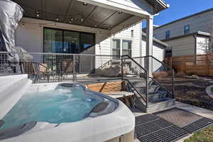 View of pool featuring a patio area and a hot tub