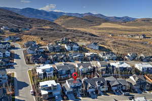 Aerial perspective of suburban area featuring a mountainous background