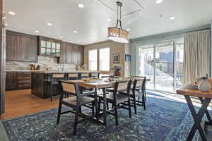 Dining area featuring recessed lighting and dark wood-style flooring