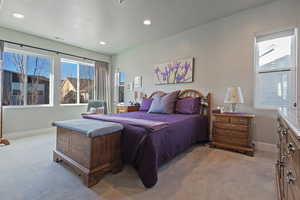 Bedroom featuring light carpet and recessed lighting