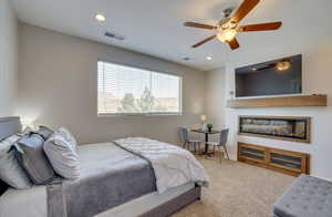 Bedroom featuring carpet, ceiling fan, and recessed lighting