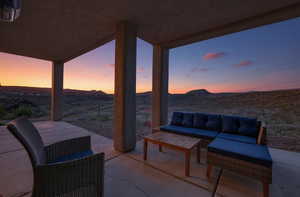 View of patio / terrace with outdoor seating and a mountain view