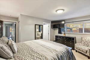 Bedroom with carpet floors and a closet