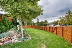 View of fenced backyard