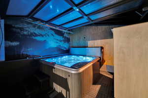 Misc room with a hot tub