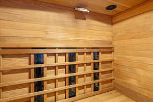 Sauna with wooden walls and wood ceiling