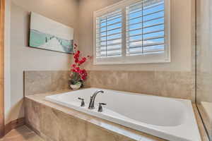 Full bathroom with a bath