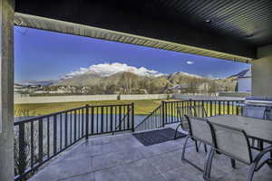 Fenced backyard featuring outdoor dining area and a patio