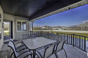 Balcony with outdoor dining space and a residential view