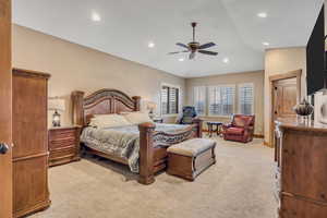 Bedroom featuring a ceiling fan, light colored carpet, recessed lighting, and lofted ceiling