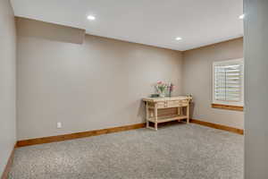 Empty room featuring carpet and recessed lighting