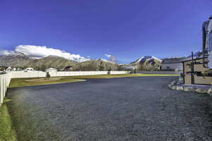 Fenced backyard with a mountain view