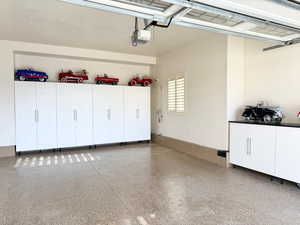 Garage featuring a garage door opener