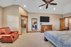 Bedroom with vaulted ceiling, a ceiling fan, recessed lighting, and light carpet