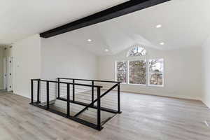 Unfurnished room with light wood-type flooring and recessed lighting