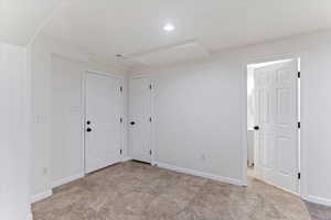 Unfurnished room featuring baseboards and recessed lighting