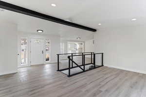 Entryway with recessed lighting and light wood-type flooring