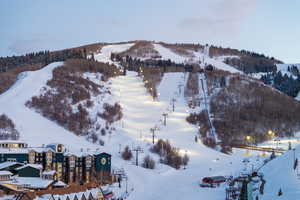 Snowy aerial view featuring a mountain view