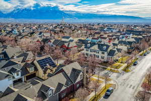 Aerial perspective of suburban area featuring a mountainous background