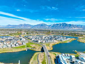 Aerial perspective of suburban area with a water and mountain view
