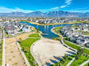 Aerial perspective of suburban area with a water and mountain view