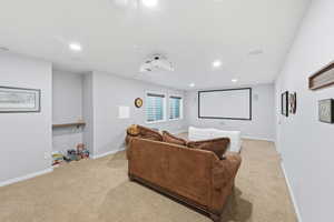 Cinema room featuring carpet flooring and recessed lighting