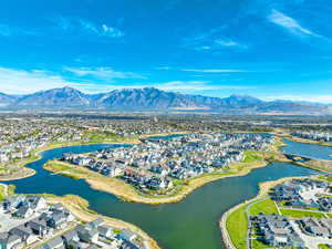 Aerial perspective of suburban area featuring a water and mountain view