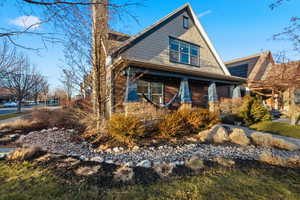 Craftsman house with a chimney and covered porch