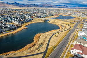 Aerial view of residential area featuring a water and mountain view